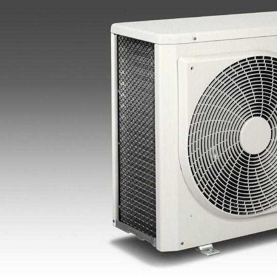 HVAC technician inspecting ductwork